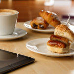 Breakfast options for meetings at Mercure hotels. Coffee, pastries and a sausage bap.