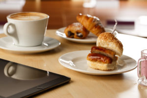 Breakfast options for meetings at Mercure hotels. Coffee, pastries and a sausage bap.