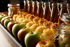 Extreme close up of apples cakes apple juice and sweetie jars a plate as part of mercure hotels meeting food offering