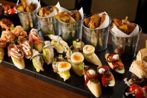Selection of open sandwiches and potato wedges, part of the meetings food options available at Mercure hotels