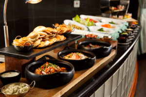 Bowls of curry, rice and naan bread at meetings buffet